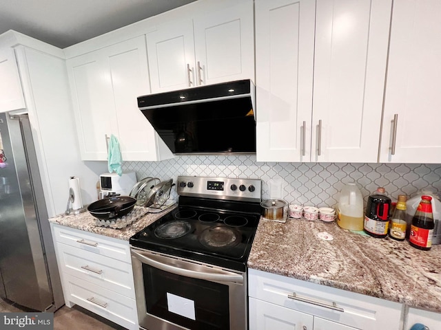 kitchen featuring decorative backsplash, light stone countertops, white cabinetry, and stainless steel appliances