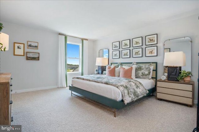 bedroom with light colored carpet