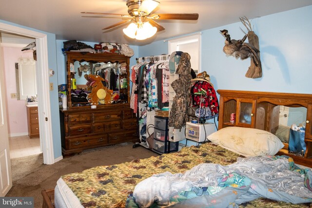 bedroom featuring ceiling fan and carpet floors