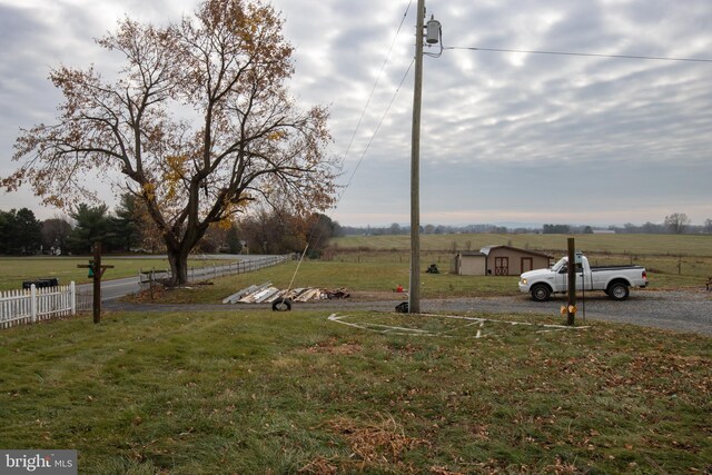 view of yard with a rural view