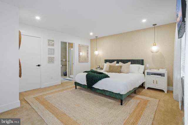 bedroom featuring carpet floors and ensuite bath