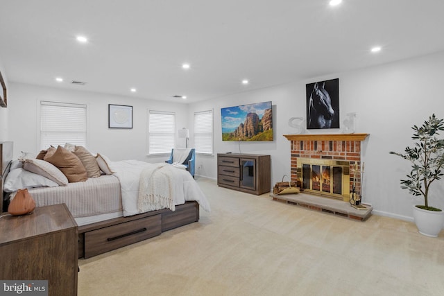 carpeted bedroom featuring a fireplace