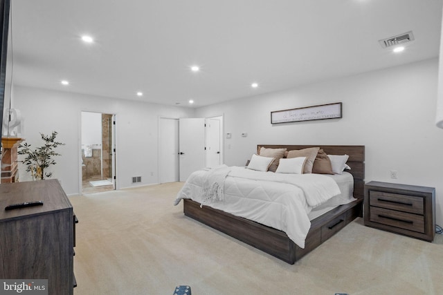 carpeted bedroom featuring connected bathroom