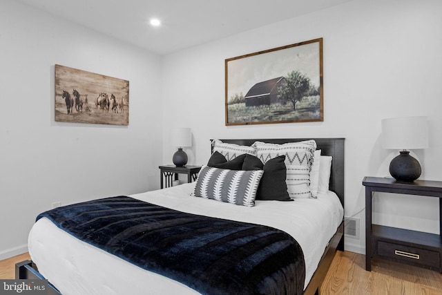 bedroom featuring light wood-type flooring