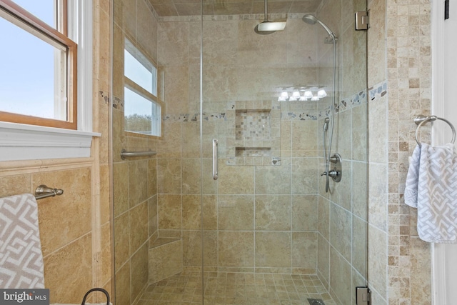 bathroom featuring an enclosed shower