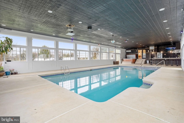 view of swimming pool with a patio area