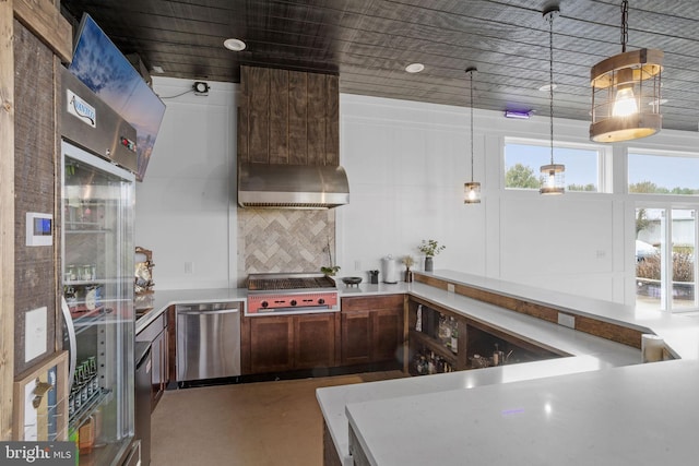 kitchen featuring tasteful backsplash, extractor fan, pendant lighting, dishwasher, and concrete floors