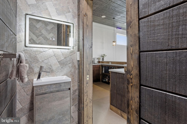 bathroom featuring vanity and concrete floors