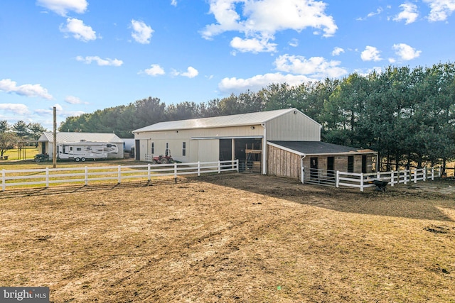 exterior space with a rural view and an outdoor structure