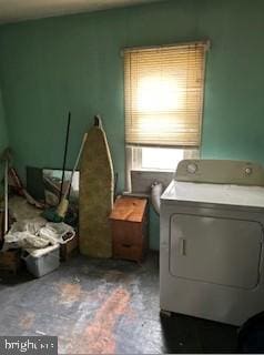 clothes washing area featuring washer / clothes dryer