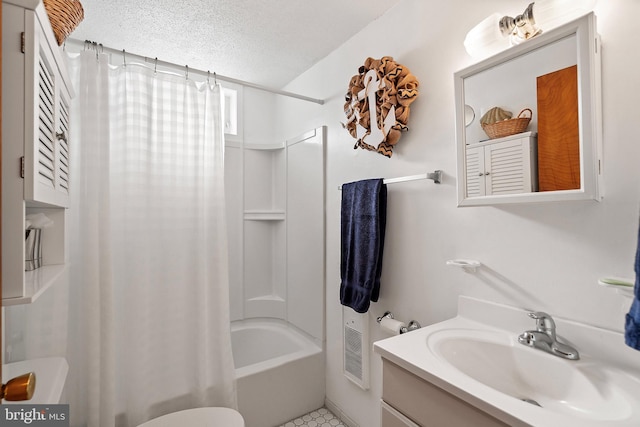 full bathroom with tile patterned flooring, a textured ceiling, toilet, shower / bath combo with shower curtain, and vanity