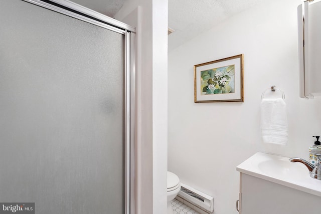 bathroom with tile patterned floors, walk in shower, vanity, baseboard heating, and toilet