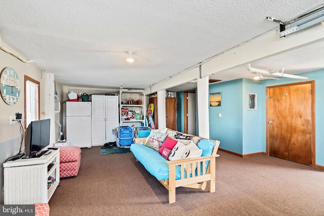 carpeted living room featuring a textured ceiling