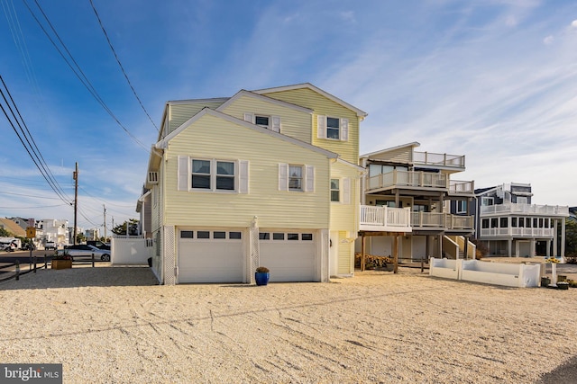 rear view of house with a garage