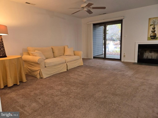 living room with carpet flooring and ceiling fan