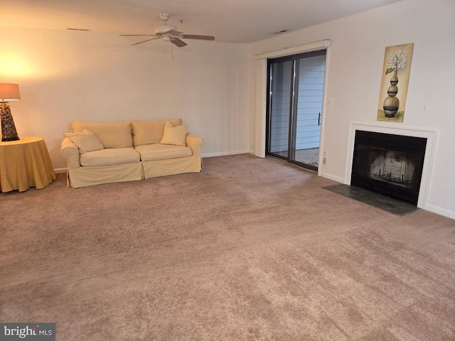 carpeted living room with ceiling fan