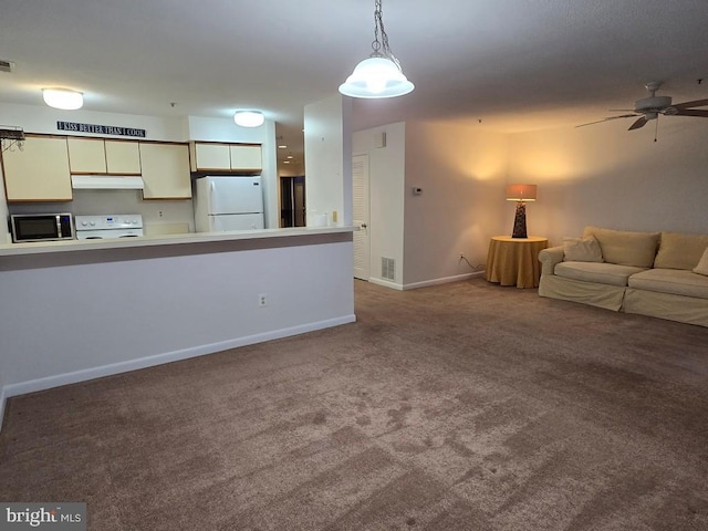 unfurnished living room with carpet and ceiling fan