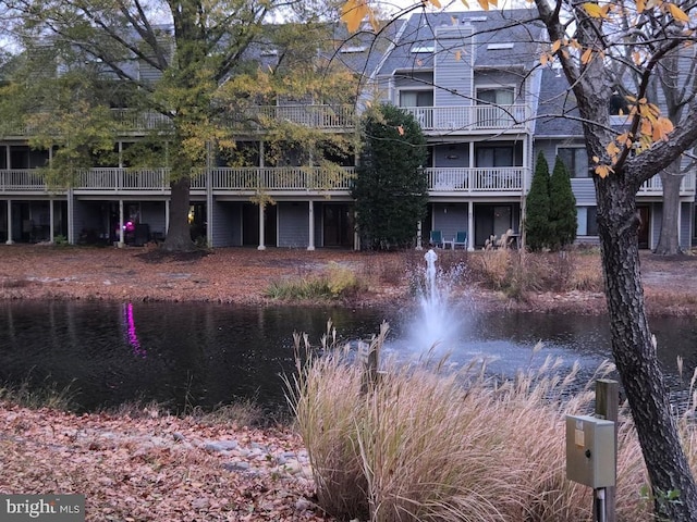 view of building exterior featuring a water view