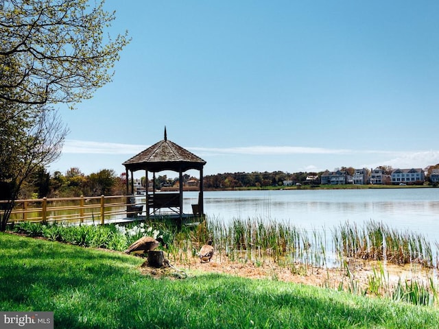 dock area featuring a gazebo and a water view