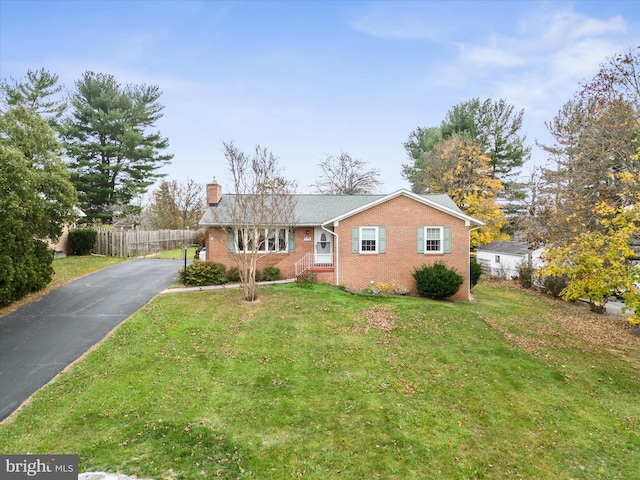 ranch-style house with a front lawn