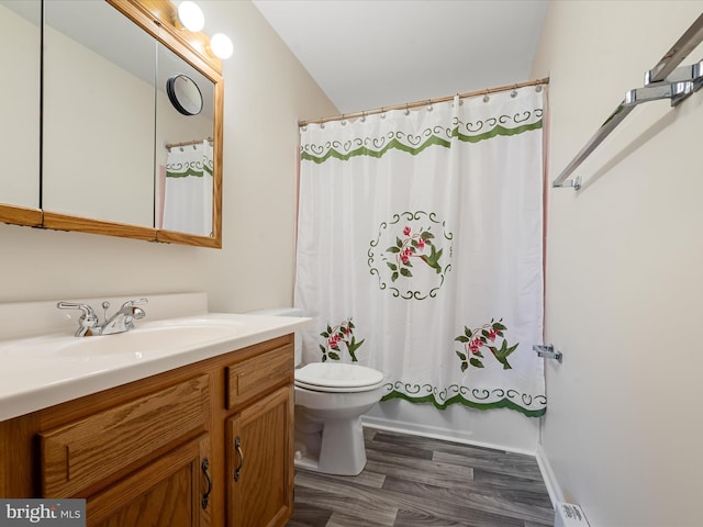 full bathroom with vanity, wood-type flooring, toilet, and shower / tub combo with curtain