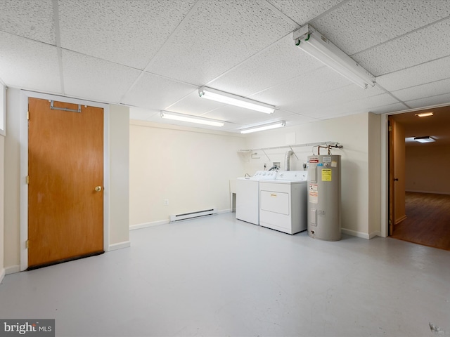 clothes washing area with a baseboard heating unit, electric water heater, and independent washer and dryer