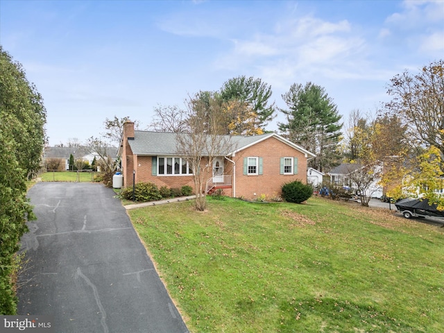 view of front of property with a front lawn