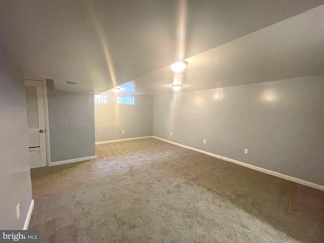 additional living space with carpet and lofted ceiling