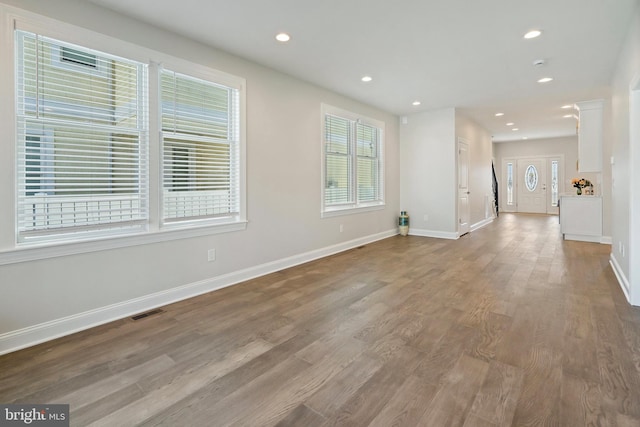 unfurnished living room featuring hardwood / wood-style floors