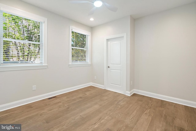 unfurnished room featuring ceiling fan and light hardwood / wood-style flooring