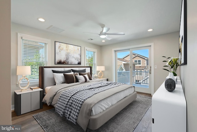 bedroom featuring hardwood / wood-style flooring, ceiling fan, and access to outside