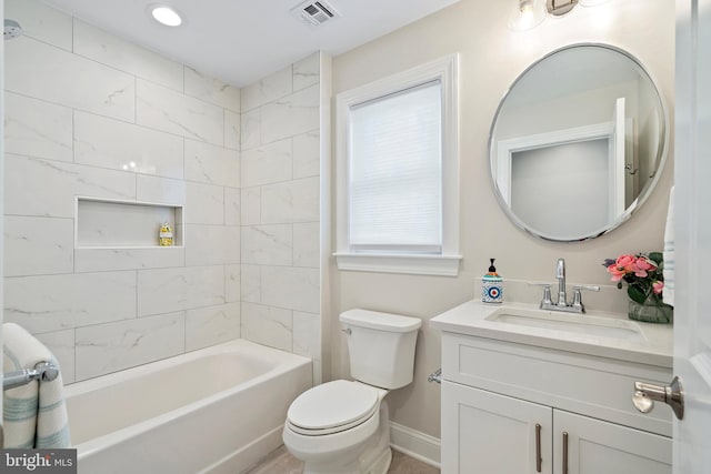 full bathroom featuring vanity, toilet, and tiled shower / bath