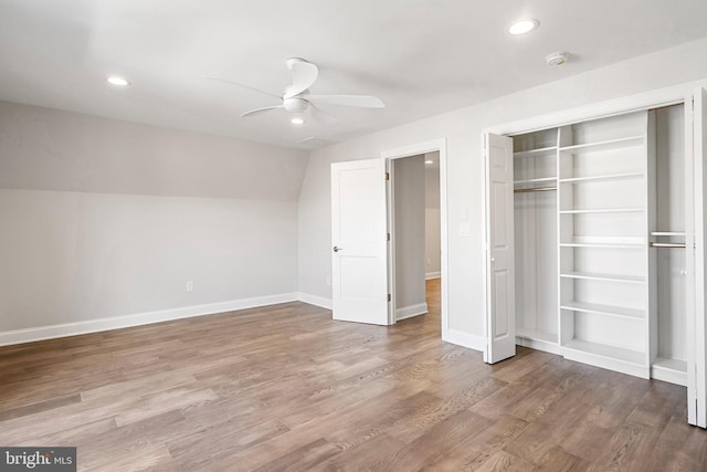 unfurnished bedroom featuring a closet, ceiling fan, and hardwood / wood-style floors