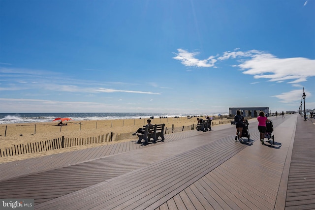 exterior space featuring a view of the beach and a water view