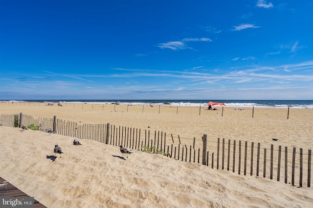 view of water feature with a beach view