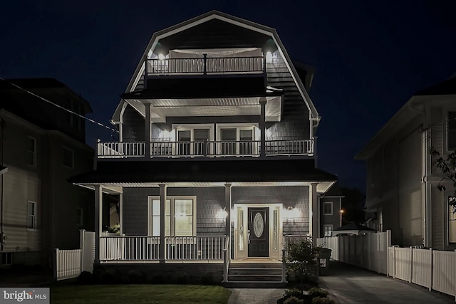 view of front of home featuring a porch and a balcony