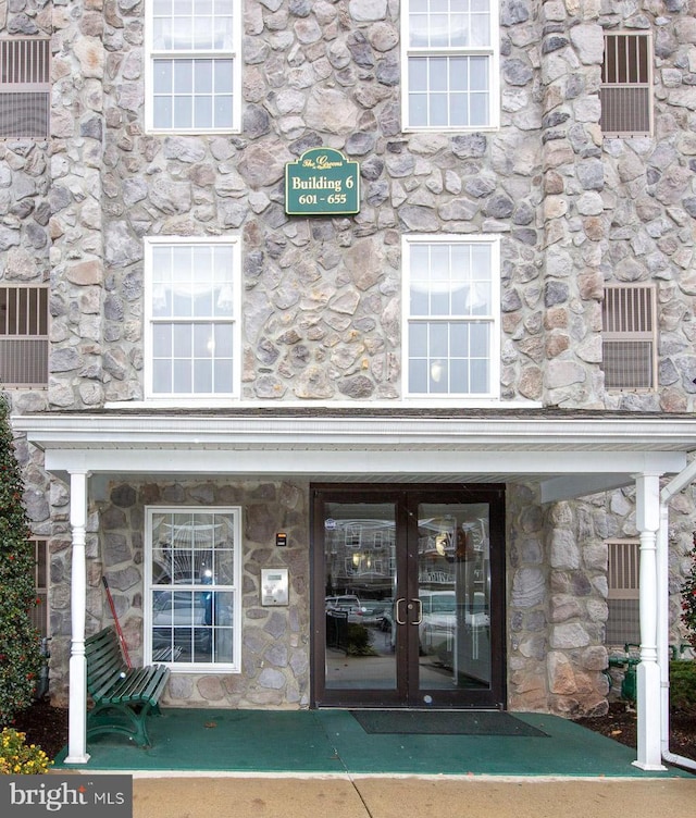 property entrance featuring french doors