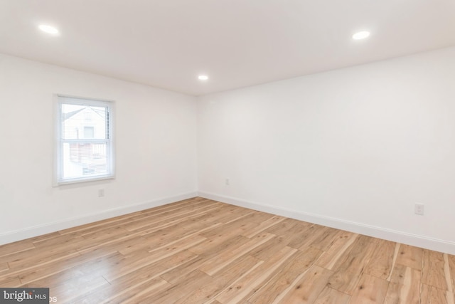 unfurnished room featuring light wood-type flooring