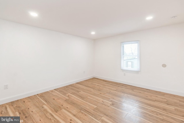 unfurnished room with light hardwood / wood-style floors