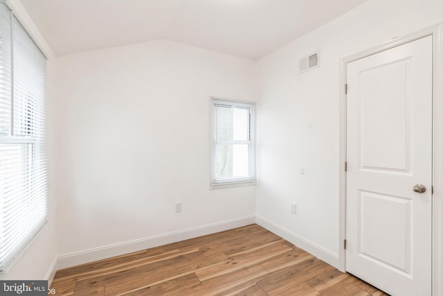 spare room featuring light hardwood / wood-style flooring