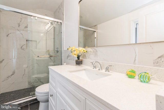 bathroom with walk in shower, decorative backsplash, vanity, and toilet