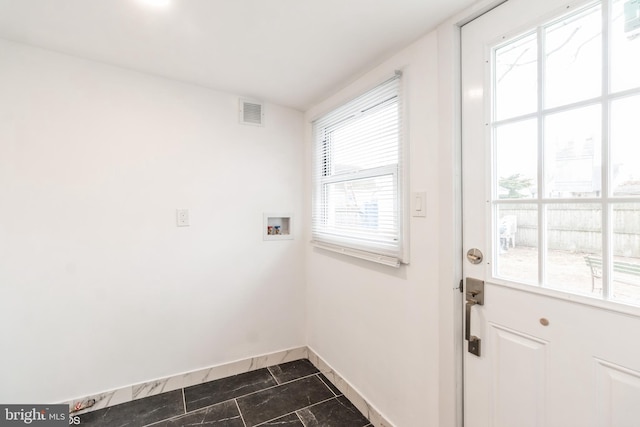 washroom with washer hookup and plenty of natural light