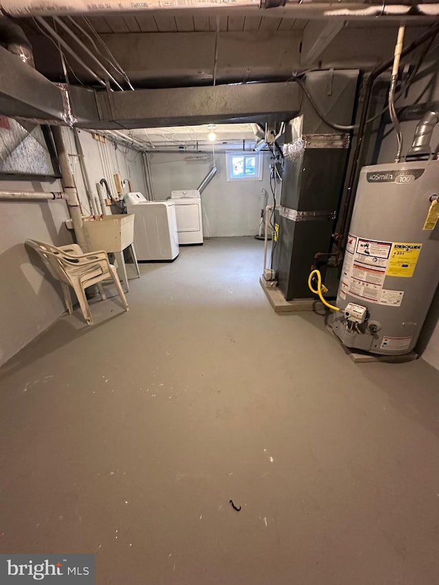 basement featuring sink, heating unit, and gas water heater