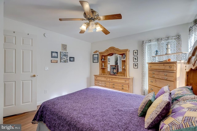 bedroom featuring ceiling fan and hardwood / wood-style floors