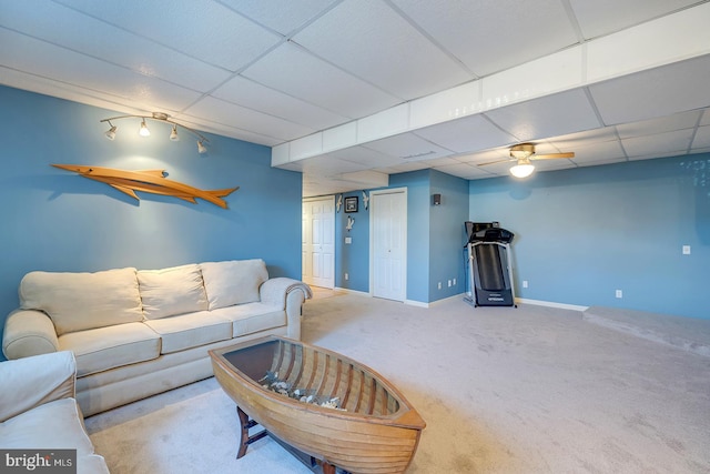 carpeted living room featuring a paneled ceiling and ceiling fan