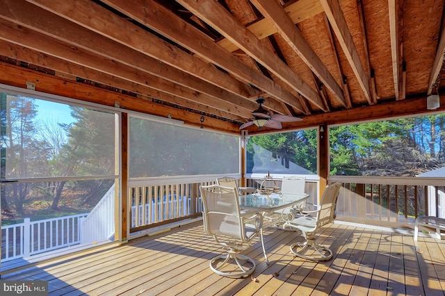 wooden deck featuring ceiling fan