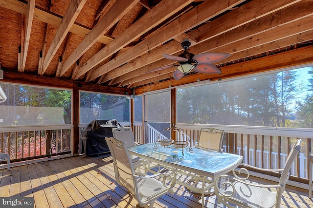 sunroom / solarium featuring ceiling fan