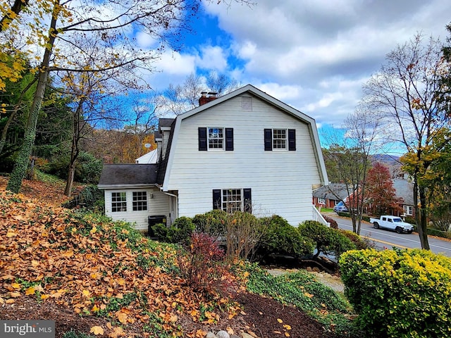 view of side of home featuring central air condition unit