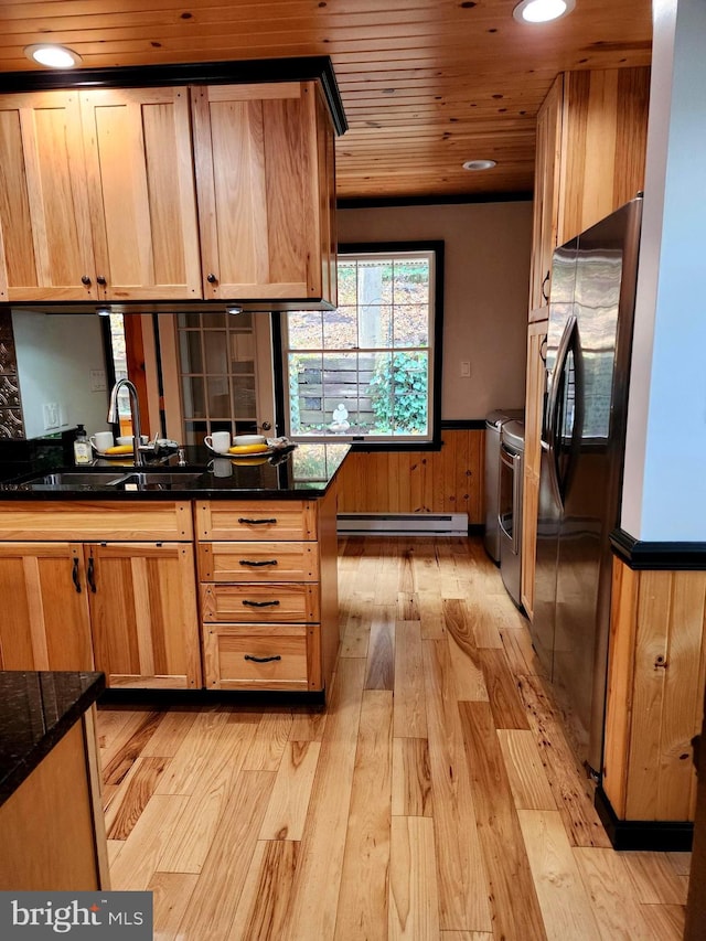 kitchen with wood ceiling, stainless steel appliances, baseboard heating, sink, and light hardwood / wood-style flooring