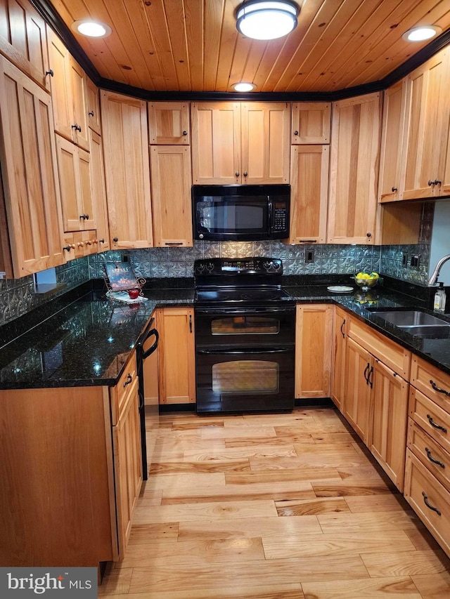 kitchen featuring wooden ceiling, black appliances, sink, dark stone countertops, and light hardwood / wood-style floors